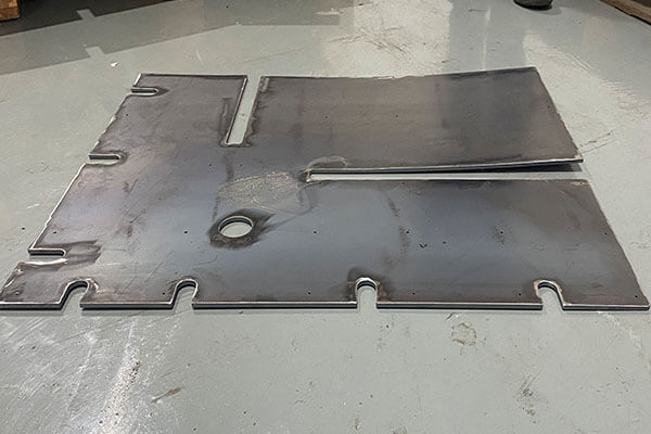 Large laser-cut parts (before and after leveling)